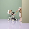 White baby stroller with colorful sunshade, black seat and yellow push rod Specification image
